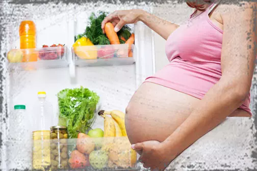 StandUpGirl pregnant woman next to healthy foods