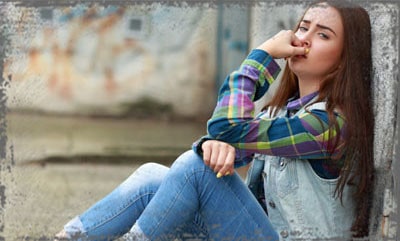 StandUpGirl sitting girl leans against wall