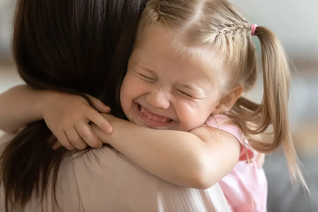 child hugging birth mom