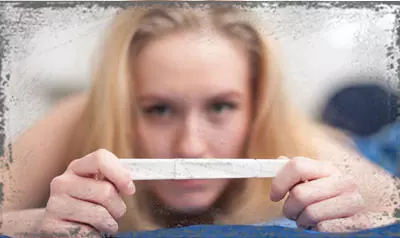 StandUpGirl woman holding pregnancy test