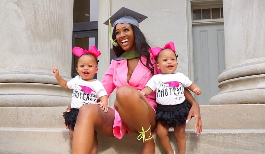 graduate with twin daughters
